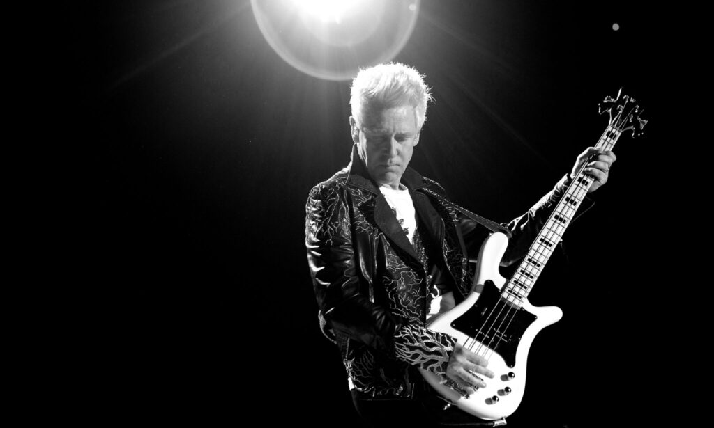 Adam Clayton on stage